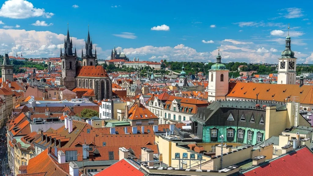 Panoramic view of iconic terracotta and copper rooftops in the historical centre of Prague, Czech Republic.